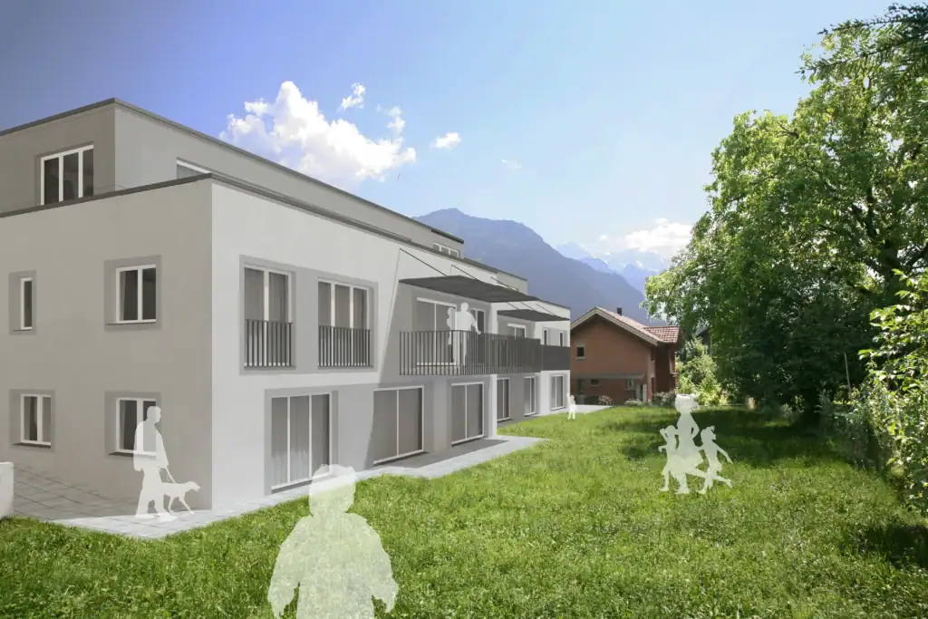 Moderne Wohnüberbauung mit grosszügigen Grünflächen und freiem Blick auf die umliegende Berglandschaft. Die hellen Wohnungen verfügen über Balkone, Terrassen und eine ruhige, naturnahe Lage mit viel Privatsphäre.